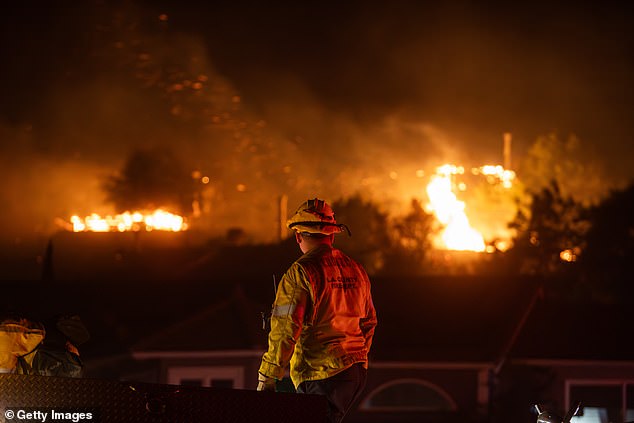 Threatening wind-driven wildfires have forced nearly 20,000 residents from their coastal homes as much of the city is under evacuation orders since Wednesday morning (fire pictured Tuesday).