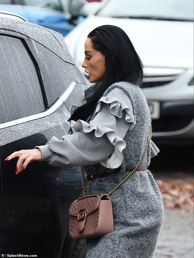 The reality star completed the look with a brown leather Gucci bag and full makeup as she left the theater.