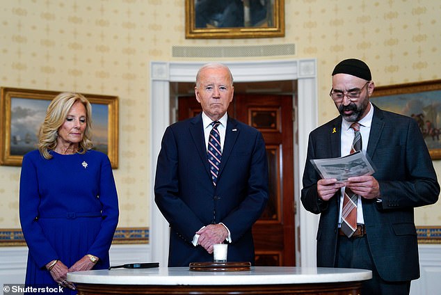 President Joe Biden bowed his head as a rabbi sang a Hebrew prayer during a somber White House ceremony marking the one-year anniversary. However, he left without saying a word about American citizens still being held hostage in Gaza