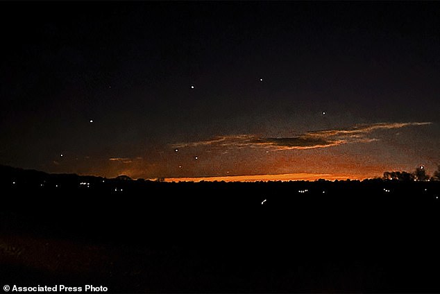 This photo by Trisha Bushey shows the evening sky and points of light near Lebanon Township, NJ, on Thursday, December 5