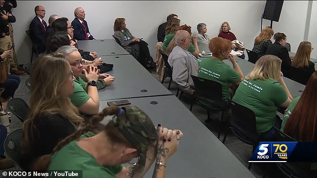 As he pleaded for his life through tears during a clemency hearing, Bolin's sister, Lori Pate, responded scathingly to the convicted killer. Bolin's family is seen here wearing the same green shirts