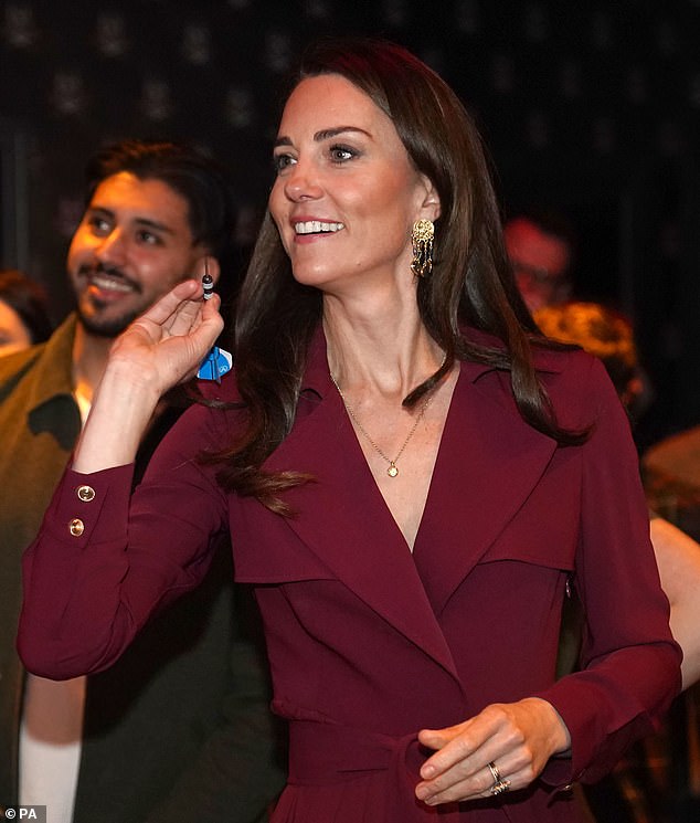 The Princess of Wales throwing a dart at Birmingham's 180 club last year