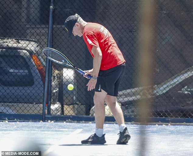 The comedian, whose radio show was axed from 2DayFM in August, looked dejected as he spent the warm day meeting a friend in Melbourne.