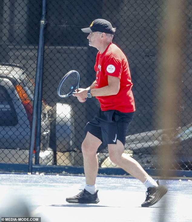 Hughesy, 54, showed off his athletic prowess in a red T-shirt and black Nike gym shorts.