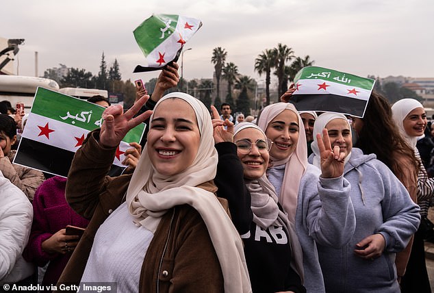 Citizens in Damascus celebrate the overthrow of President Bashar Assad