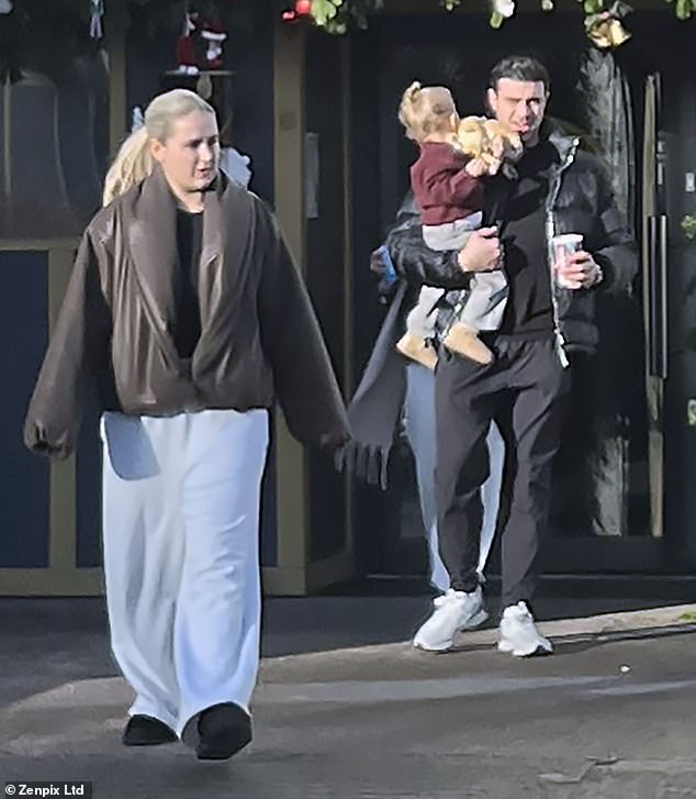 Molly-Mae bundled up in a brown puffer jacket which she paired with loose-fitting cream joggers for the surprise outing.