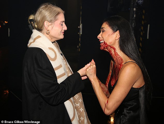 Nicole turned heads in a tight black dress after the show and was still covered in fake blood from the show.