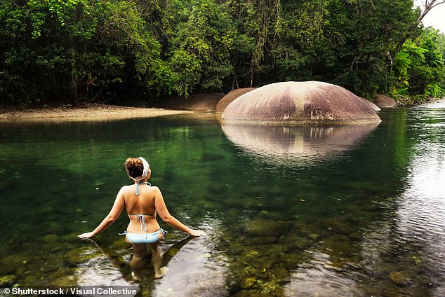 The secluded waterfall is not far from the infamous Babinda Boulders (pictured)