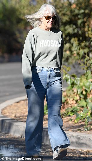 During their rare outing, Dawber looked chic and casual during a relaxing walk in a quiet neighborhood.