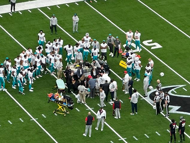 Dolphin players watched over Dubose and later knelt in prayer as medics tended to him