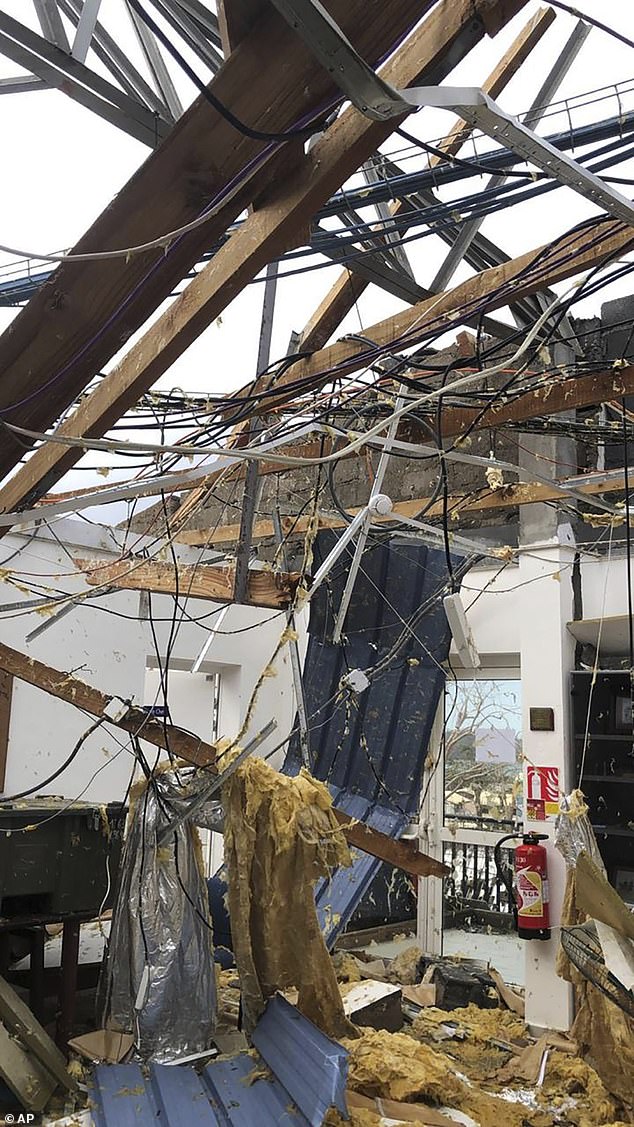 This photo provided on Sunday, December 15, 2024 by the French military shows a damaged house in the French territory of Mayotte, in the Indian Ocean.