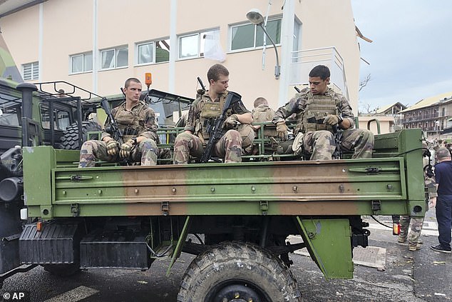 This photo provided on Sunday, Dec. 15, 2024, by the French military shows soldiers patrolling in a military truck in the French territory of Mayotte in the Indian Ocean, after Cyclone Chido caused extensive damage and several deaths were reported.