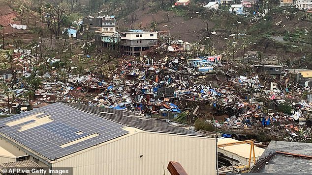 A photo taken on December 15, 2024 shows a pile of debris of metal sheets, wood, furniture and belongings after Cyclone Chido hit the French Indian Ocean territory of Mayotte.