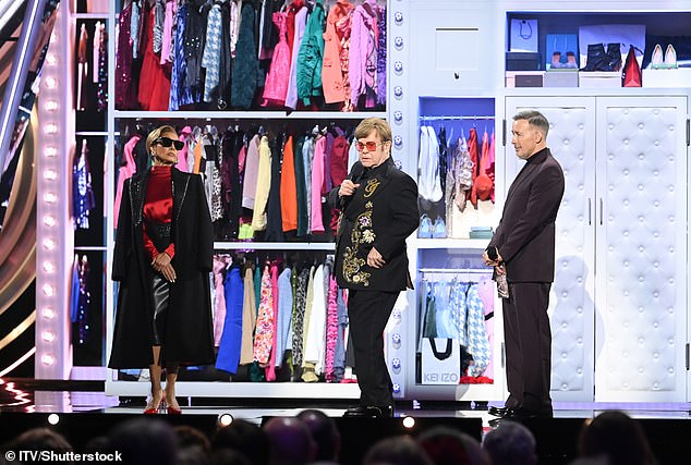 Sir Elton John (C) and his husband David Furnish (R) introduce the cast of his new musical The Devil Wears Prada, directed by Vanessa Williams (L)