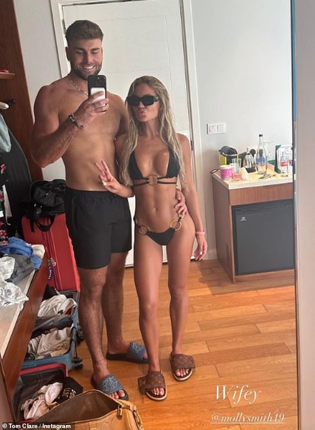 Tom sparked engagement rumors in June when he called Molly his 'wife' during their getaway to the Maldives (pictured) - but Molly says he hasn't popped the question yet.