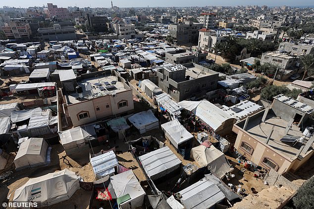 Displaced Palestinians take shelter in a tent camp, amid the conflict between Israel and Hamas, in Deir Al-Balah in the central Gaza Strip, December 15, 2024