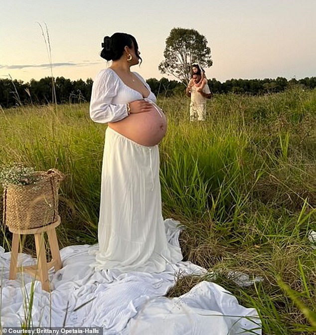 Brittany photographed during her second pregnancy with her partner Rajan and daughter Malayisa-Maree in the background.