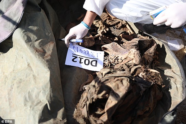 Bags marked with prison codes and what are believed to be the names of the deceased were found.