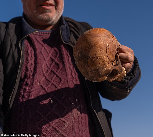 Corpse remains believed to belong to civilians killed by Bashar al-Assad's regime are being excavated from a mass grave in the Baghdad Bridge area on the outskirts of the Syrian capital.