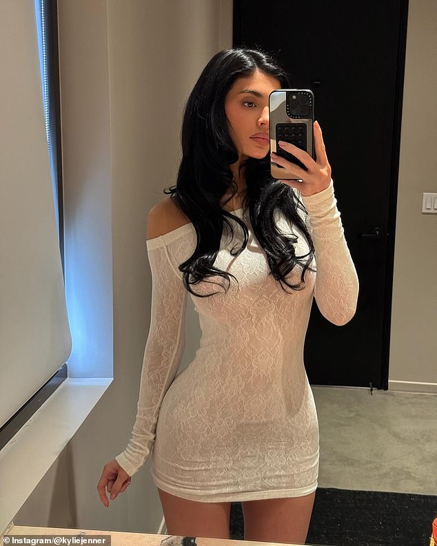 Kylie showed off her petite frame in a white lace dress as she posed for an Instagram photo