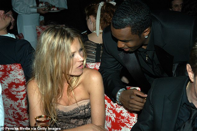 Kate Moss is seen with Sean 'Diddy' Combs at a fashion show in New York City in 2005.