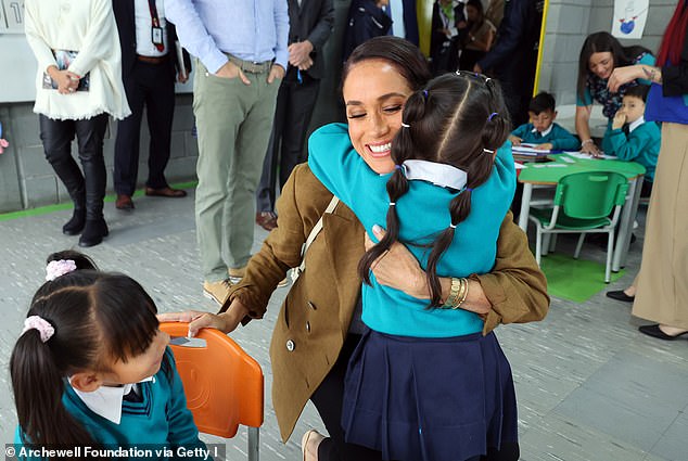 A photo of the Duchess of Sussex, Meghan, during a visit in August to a children's school in Colombia