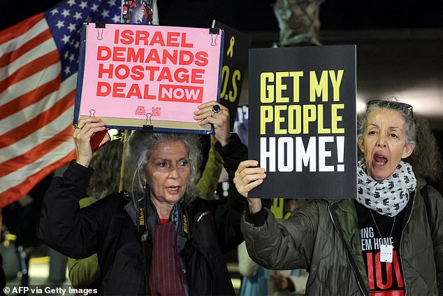 Relatives of Israelis held hostage by Palestinian militants in Gaza since the October 7 attacks, and supporters, gather for a demonstration calling on the US to intervene for their release outside the US Embassy branch on December 12, 2024 in Tel Aviv.