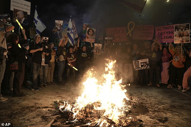 Israelis protest against Prime Minister Benjamin Netanyahu's government and call for the release of hostages held in the Gaza Strip by the militant group Hamas, in Tel Aviv, Israel, Saturday, December 7, 2024