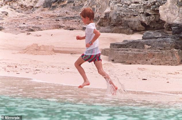 Prince Harry is shown running along a sandy beach in the Bahamas in 1993.