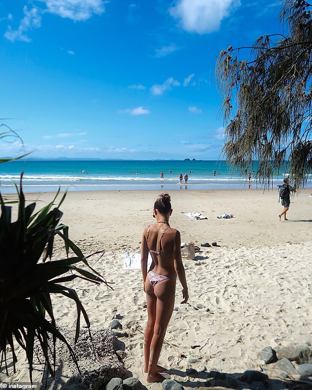 One image showed the beauty turning her back to the camera while wearing a tiny triangle bikini. The pale swimsuits left little to the imagination.