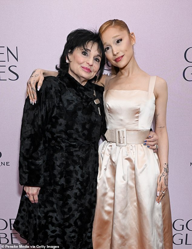 Arriving at the star-studded event, the Wicked star, 31, appeared in high spirits as she strutted down the red carpet with her mom, Joan Grande, as her date.