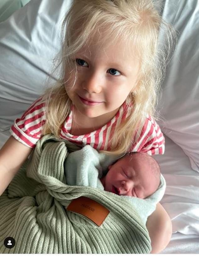 Jules posted a touching photo of her three-year-old daughter, Piper Rose, cradling her new baby brother at Mater Mothers Hospital.