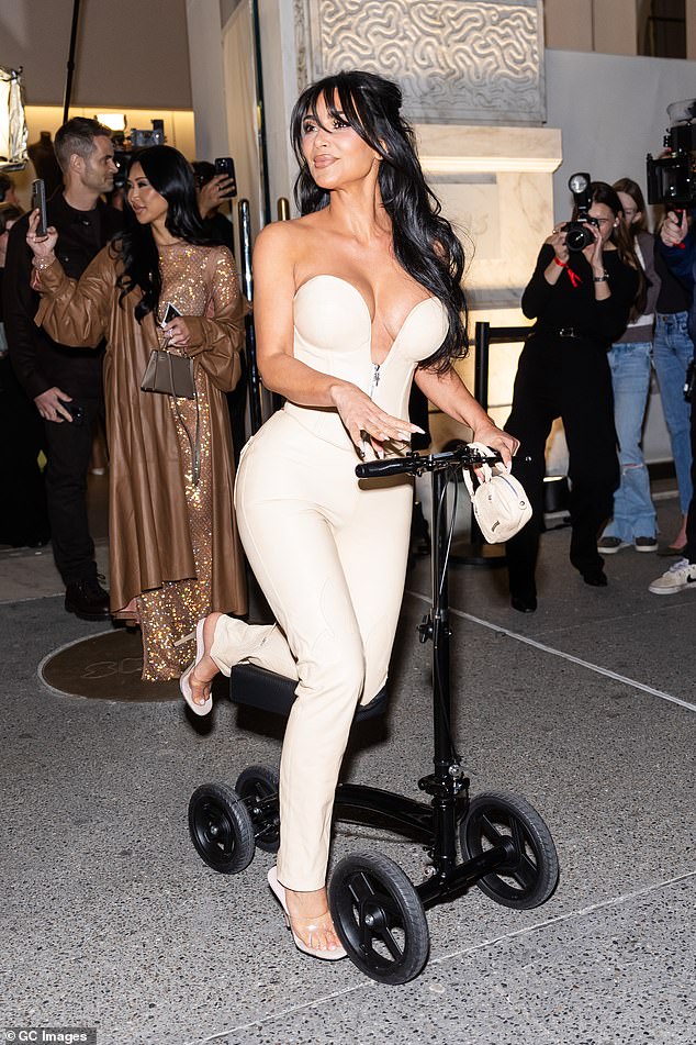 While attending the opening of her new SKIMS store in New York City last week, Kim used a scooter to get around. She also put a high heel on her broken foot.