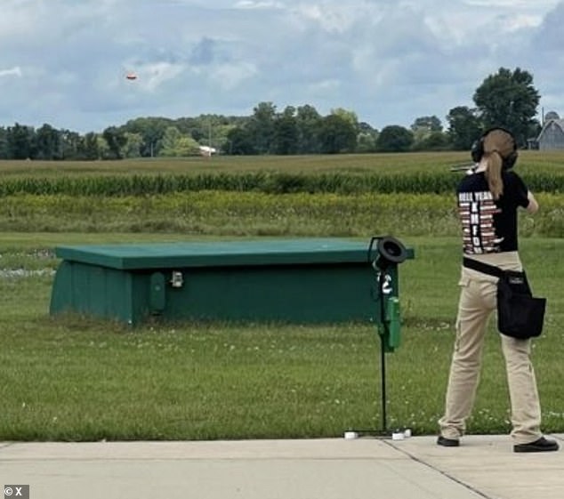 Jeff Rupnow shared a photo of one of his daughters being encouraged by her father to handle and fire guns. Mr Rupnow shared a photo (above) on Facebook at a local shooting range in August