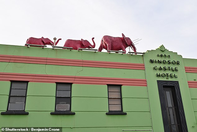 The Windsor Castle Hotel has three distinctive pink elephants on the roof (pictured)