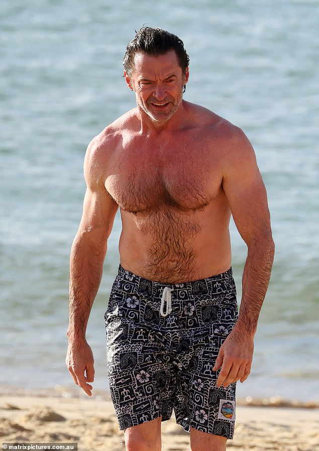 The Australian actor, 56, proved he stays in superhero shape as he flaunted his muscular physique during his day at the beach.