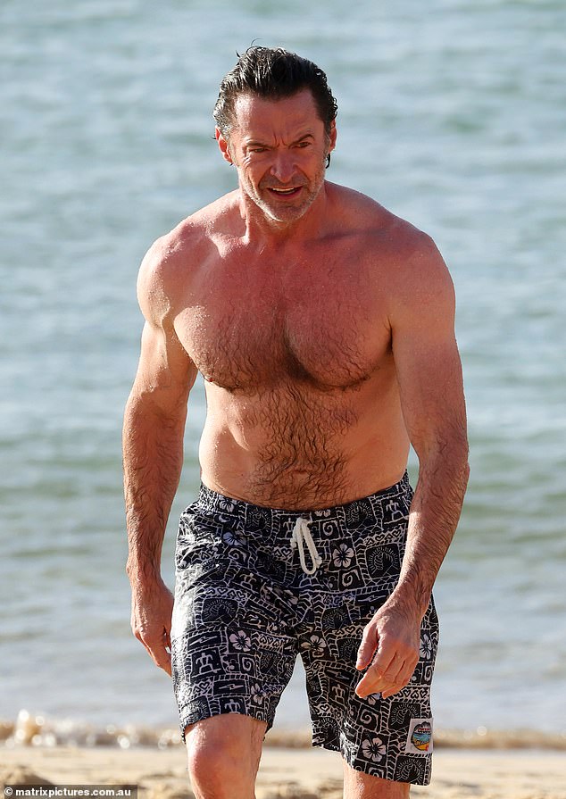 Hugh cooled off in the wet weather by swimming in the sea and then walked along the beach in the pleasant warmth.