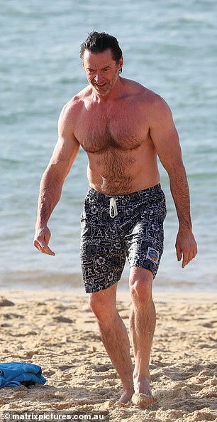 Hugh showed he hasn't let his hard work go to waste as he continues to show off his enviable muscles during his day on the beach.