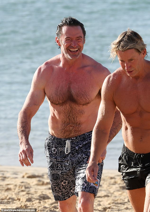 During his latest beach outing, Hugh appeared to be in good spirits as he met up with his close friend and trainer Michael.