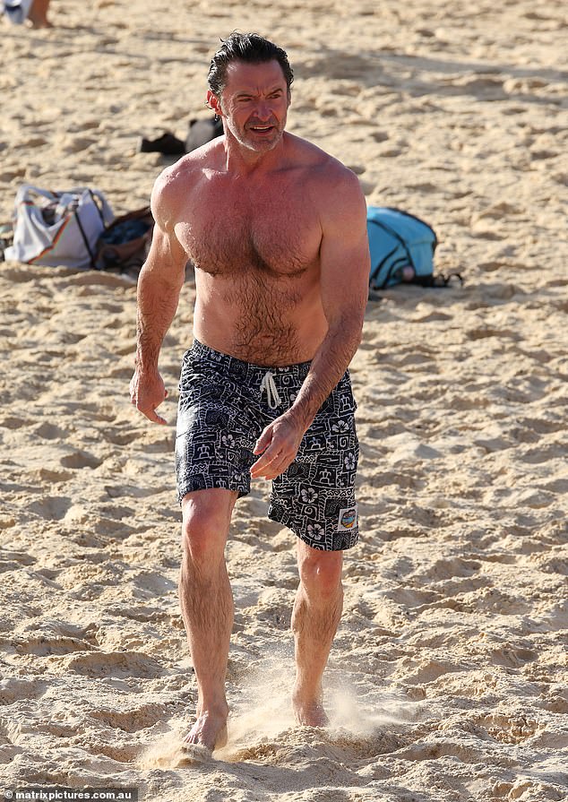 Hugh, who lives in New York, showed off his muscular figure while going shirtless during his beach outing.