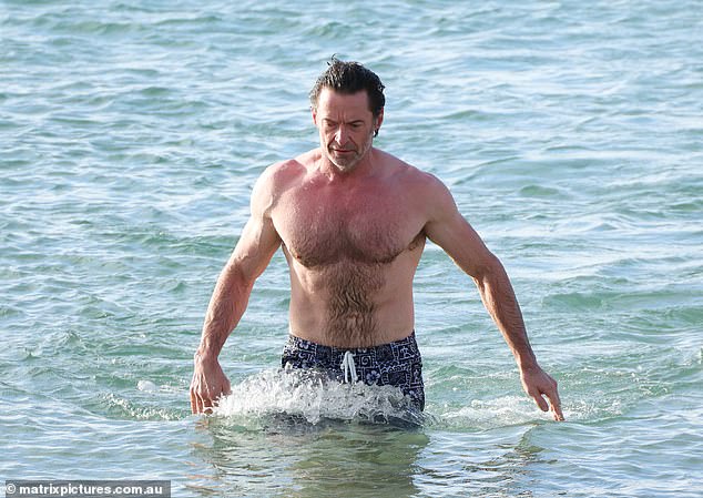 Hugh cooled off with a dip in the sea as he made the most of his time in his native Australia for the Christmas holidays.