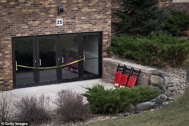 Police tape is stretched over the doors of Abundant Life Christian School as police continue to investigate