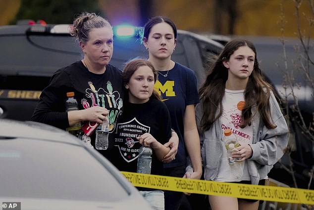 The shooting left two dead and six injured, two of whom are in critical condition. A family is seen leaving the reunification center after the tragedy