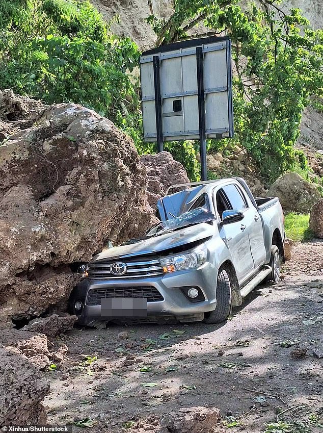 Huge boulders have crushed and blocked roads