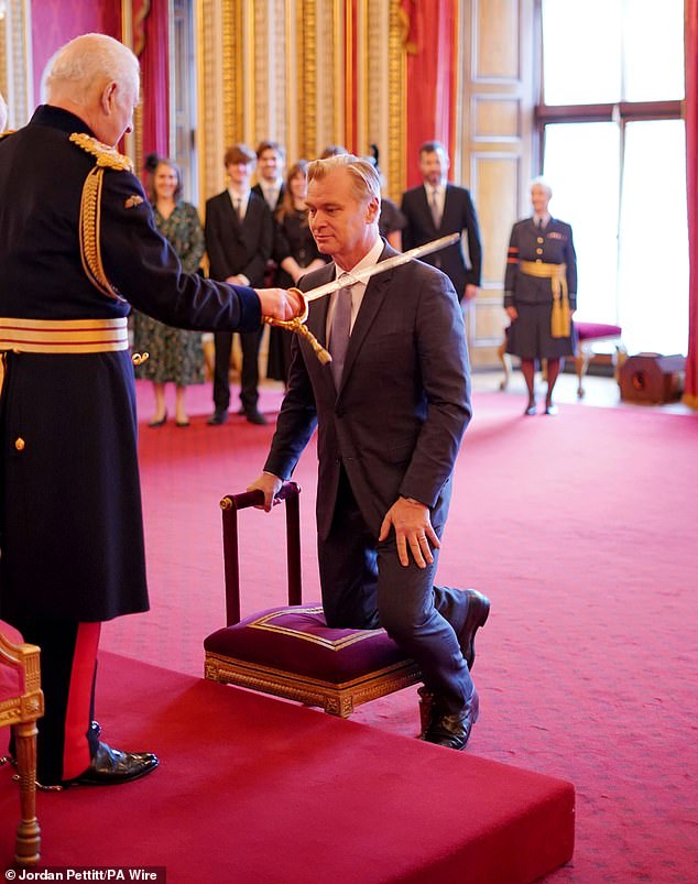 The Inception director, 54, was formally awarded a knighthood.