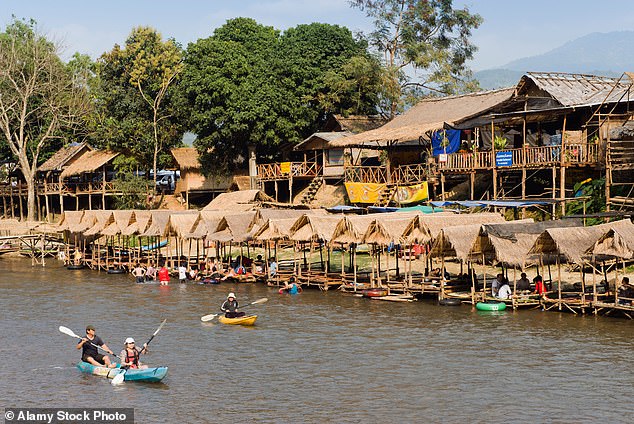 Kayaking tourists in the party town of Vang Vieng in Laos, where six people died from suspected methanol poisoning.