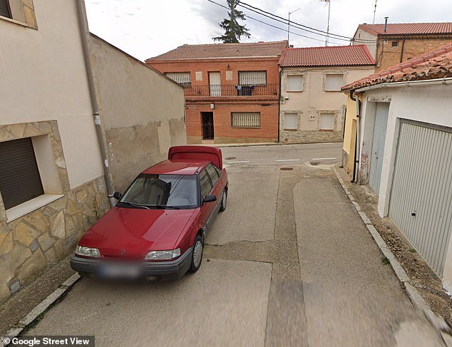 Google Street View images show the red Rover parked on the side of the road, with the trunk open.