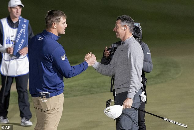 DeChambeau shakes hands with McIlroy after the climax of the event at Shadow Creek