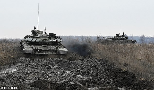 Russian T-72 tanks drive during military exercises at a firing range amid the conflict between Russia and Ukraine, in the southern Krasnodar region, Russia, Dec. 2, 2024.