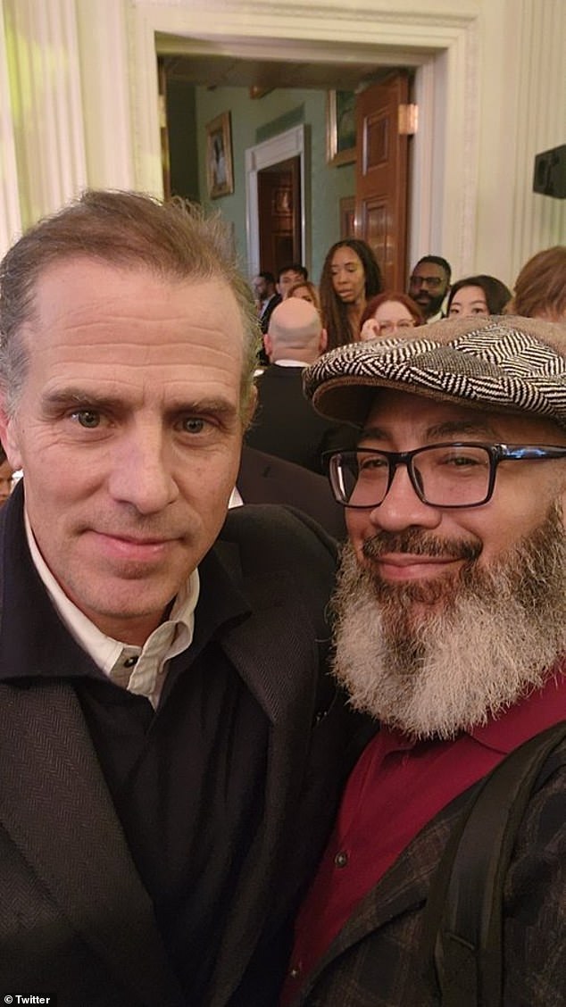 Hunter Biden poses with a guest during a Hanukkah reception at the White House